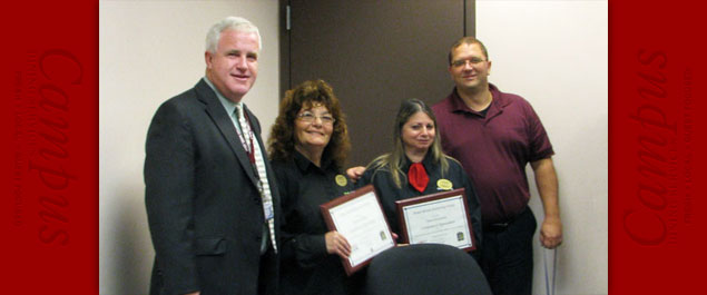Roseann Maria receiving award from University Police
