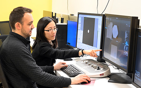 Student and Professor at computer