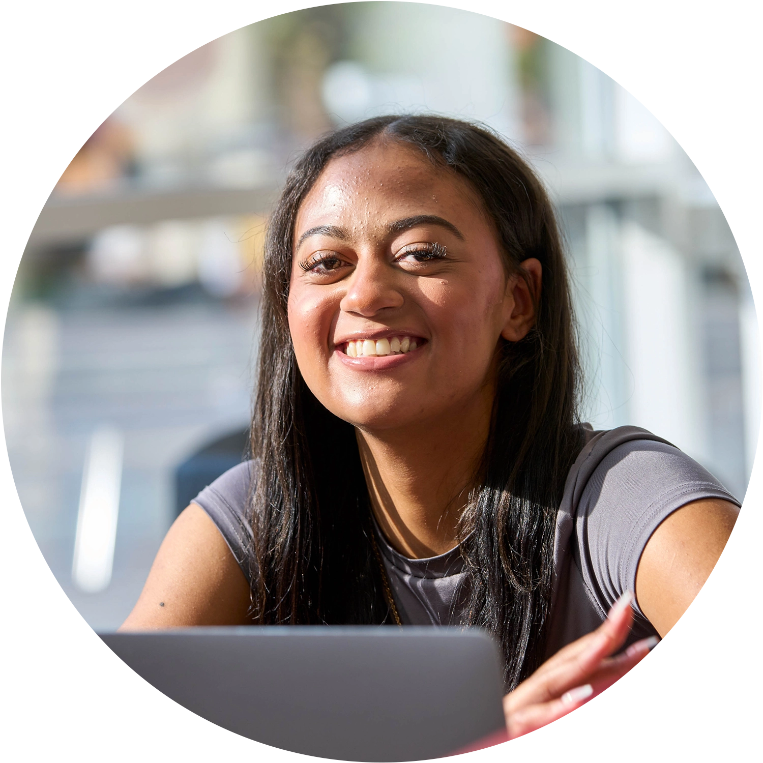 Two College of Business Students focusing on their classwork while attending a lecture