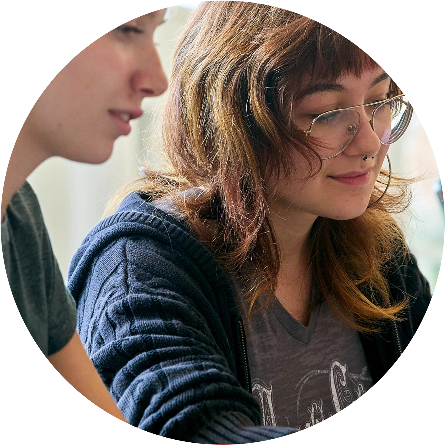College of Business Students focusing on their classwork while attending a lecture