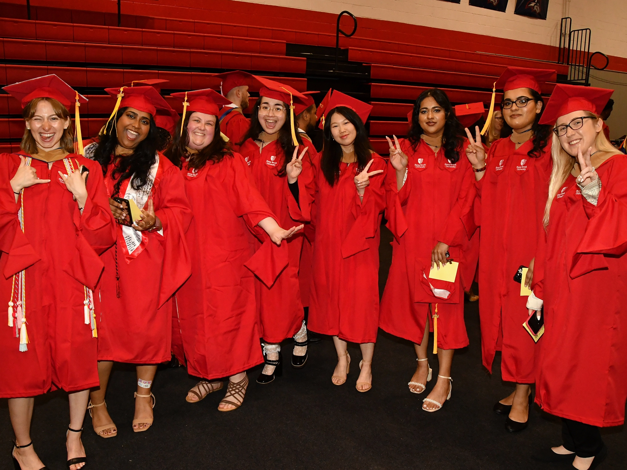 Stony Brook University College of Business students at convocation walking out