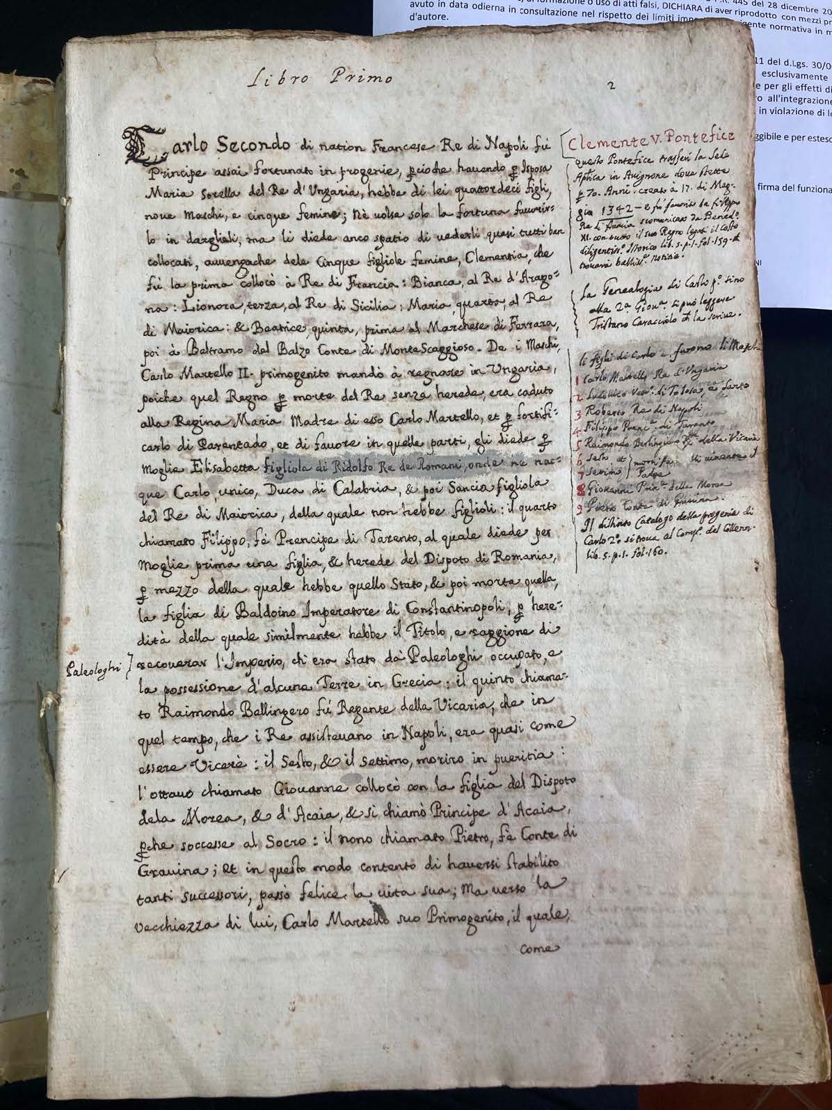 A manuscript featuring a prominent red line drawn across its pages.