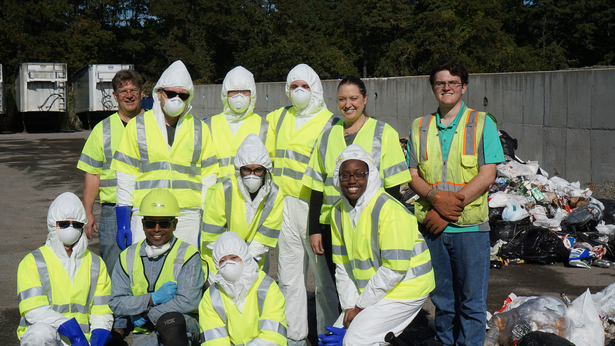 Workers in safety gear posing for a group photo