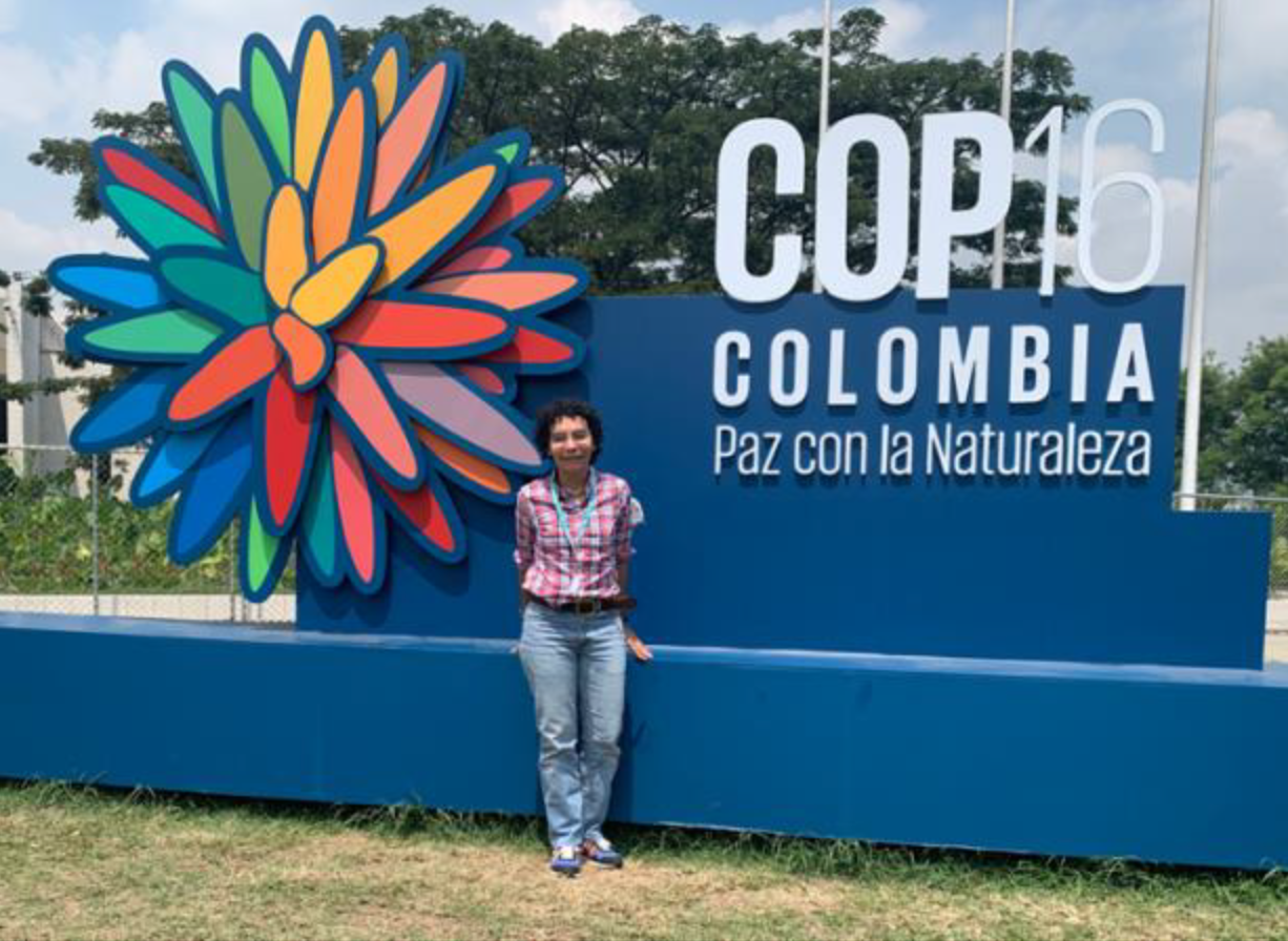 Liliana Davilos at entrance to CoP16