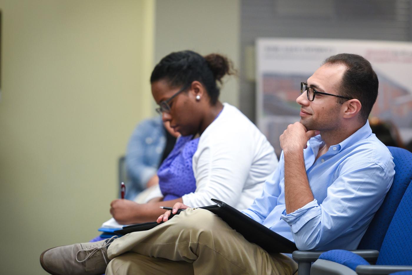 Man and woman in lecture hall