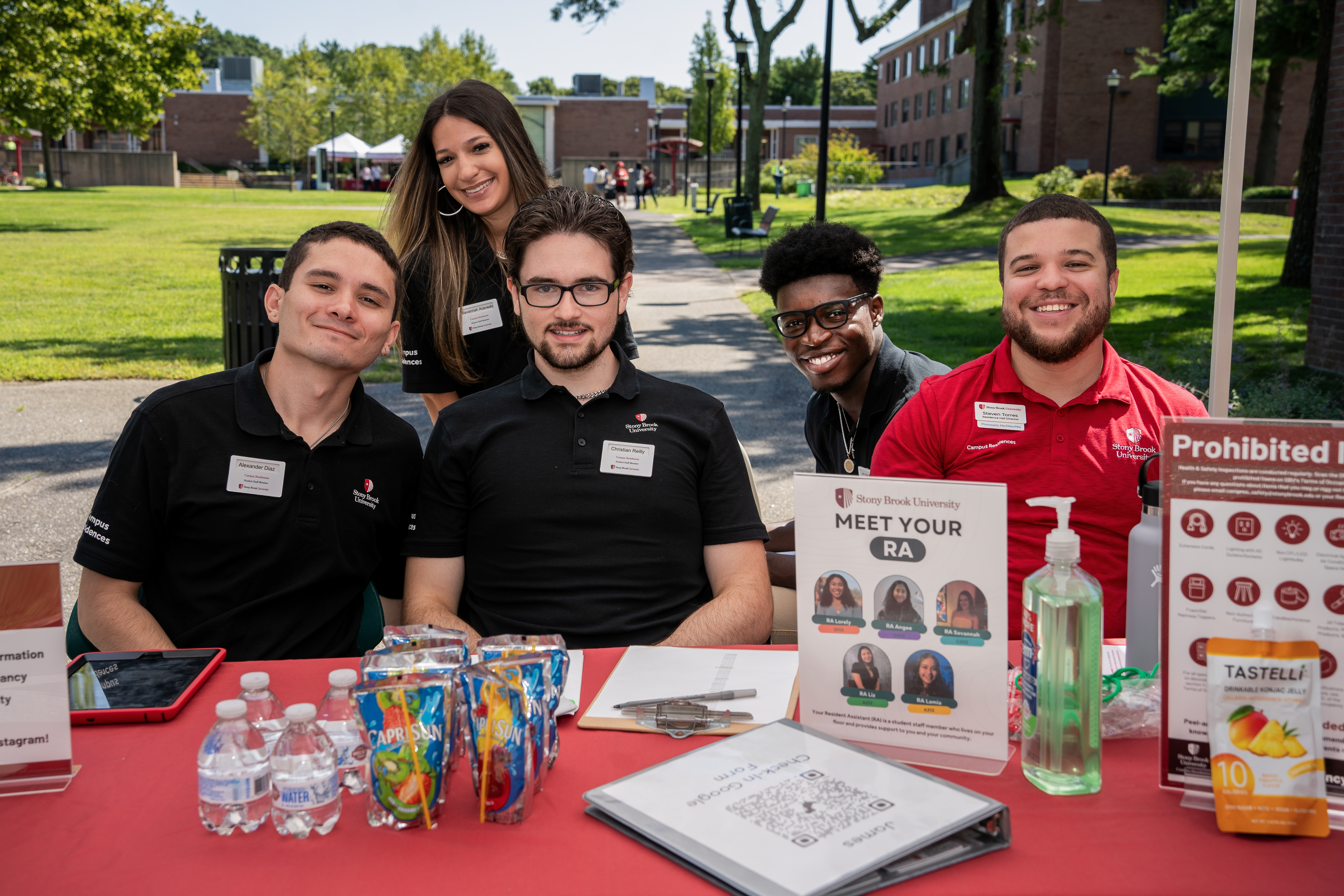 RAs at a check in table for move in